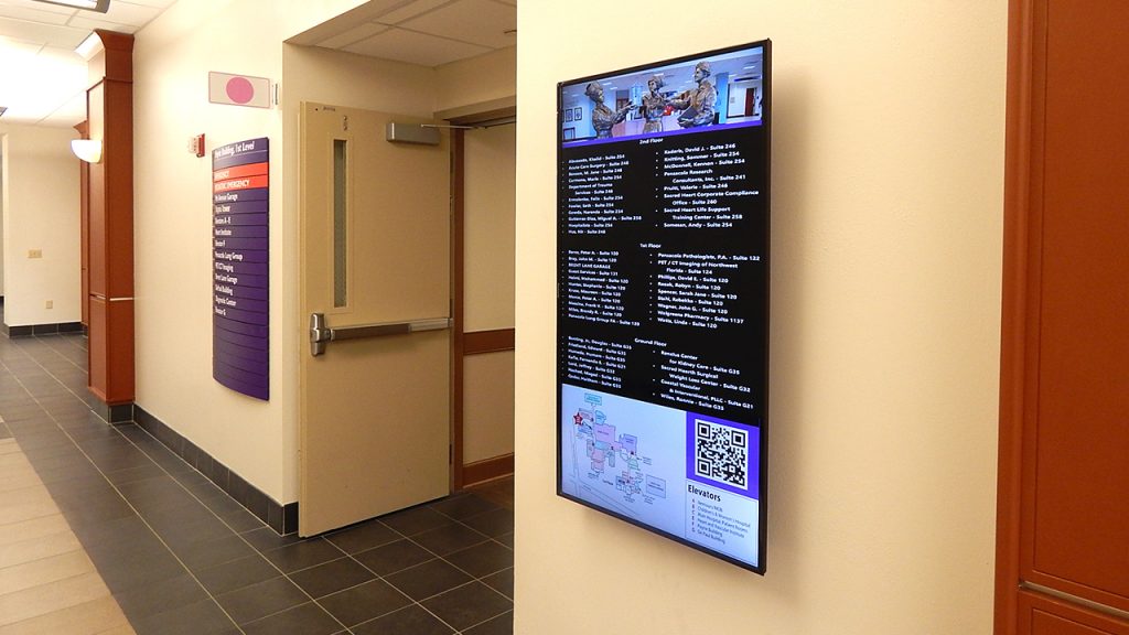 Digital signage display in a hospital corridor
