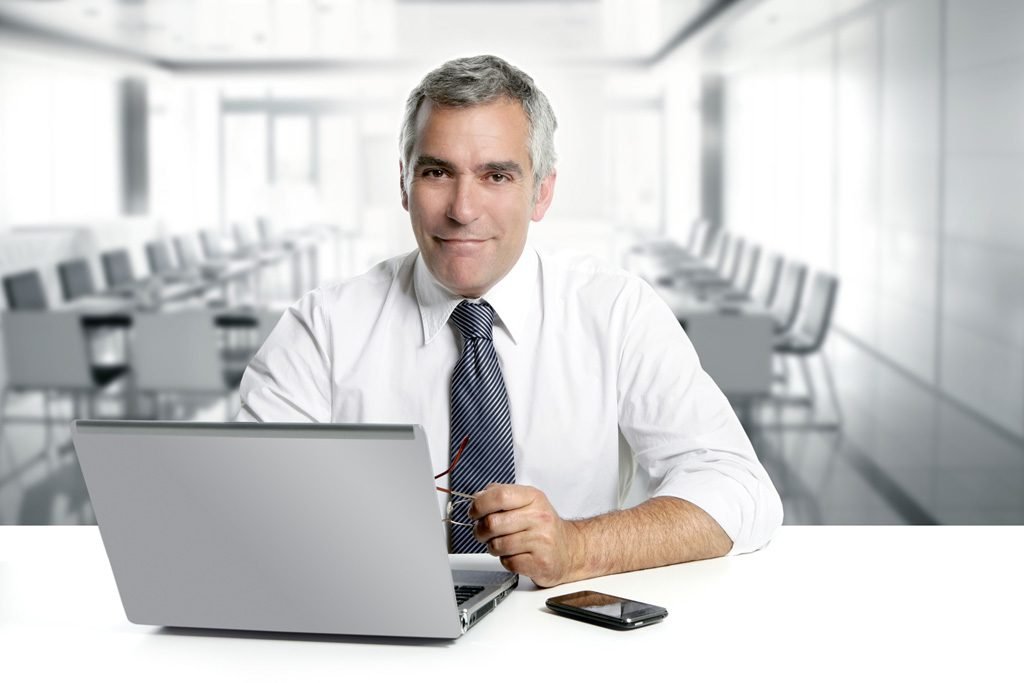 Businessman working on a laptop in a modern office