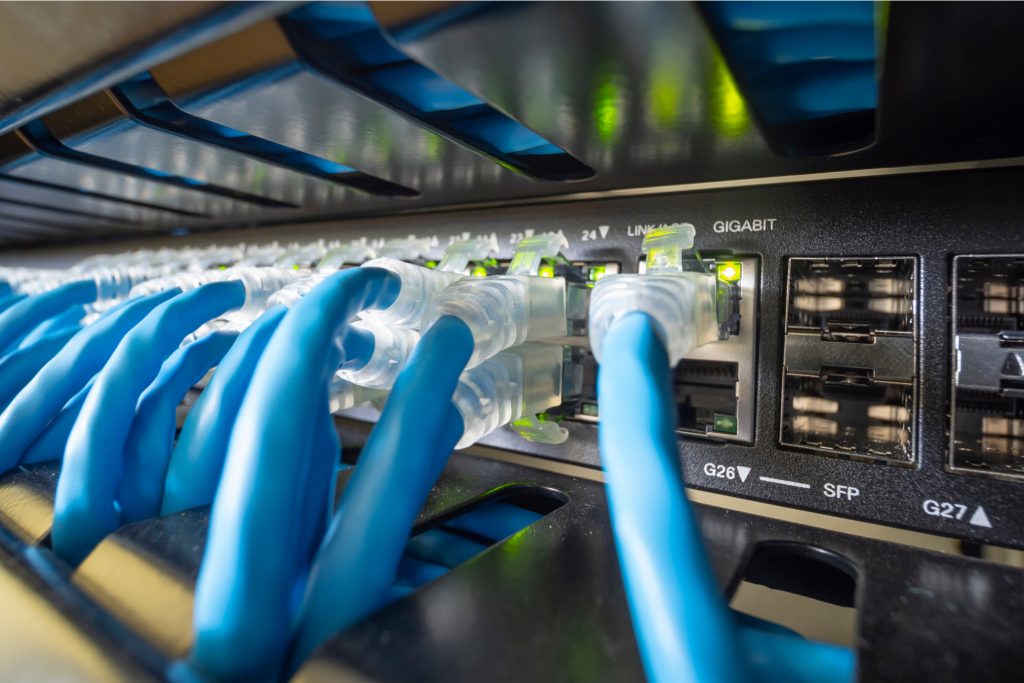 Network switch with blue Ethernet patch cables